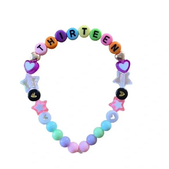 Taylor Swift Handmade Friendship Beaded Bracelet
“Thirteen” - Picture 1 of 2